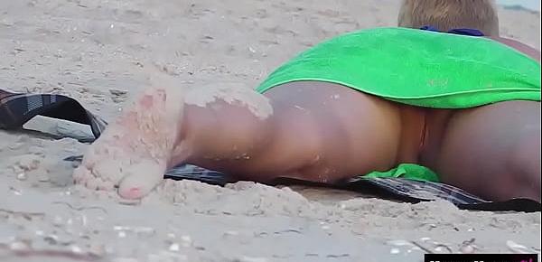  Voyeur hidden cam -  Girl on a nude beach in Italy!